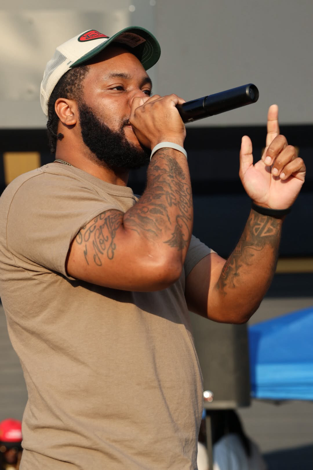 Close-up of Velly Beretta performing with a microphone