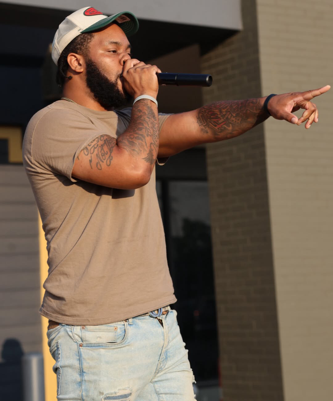 Velly Beretta pointing into the crowd during a performance